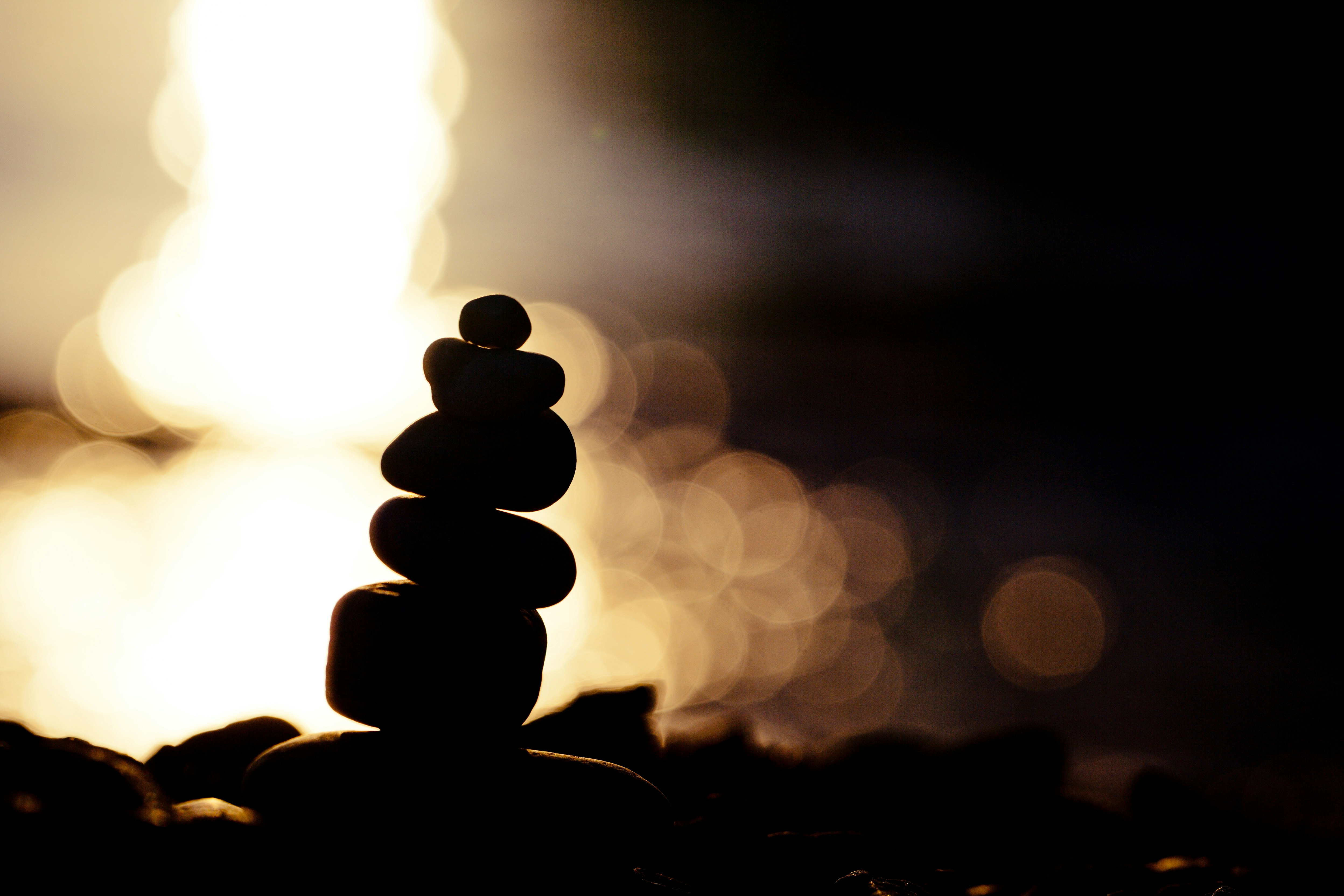 silhouette of round stones on ground